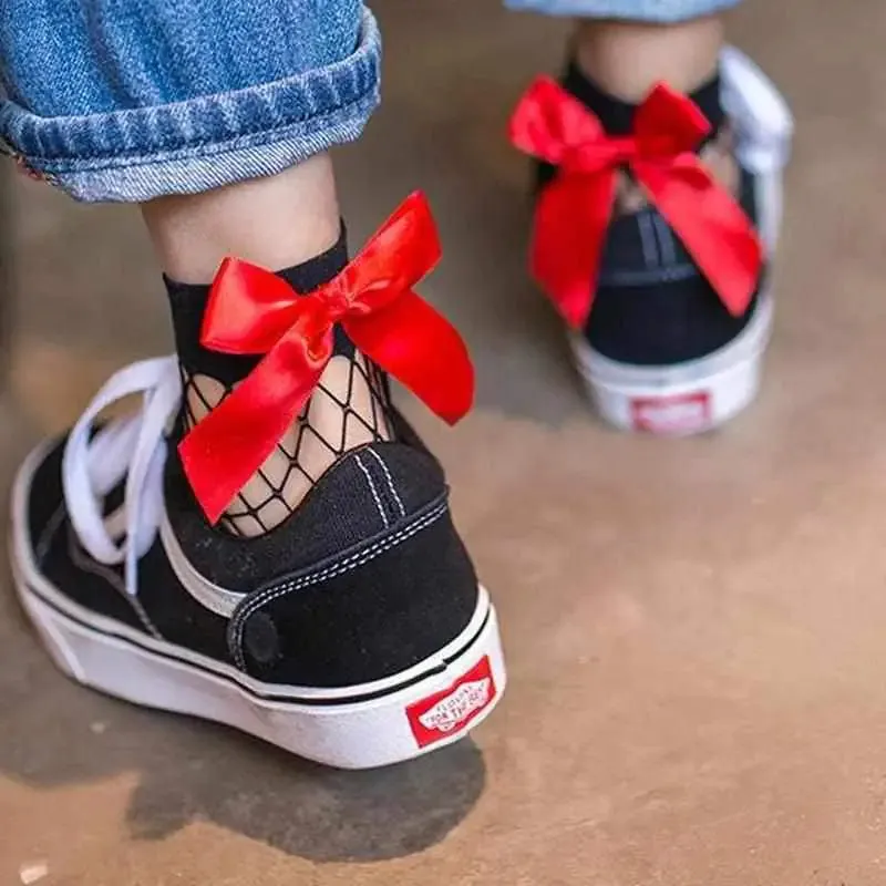 Chic Flair Bowtie Fishnet Socks Showcase Style